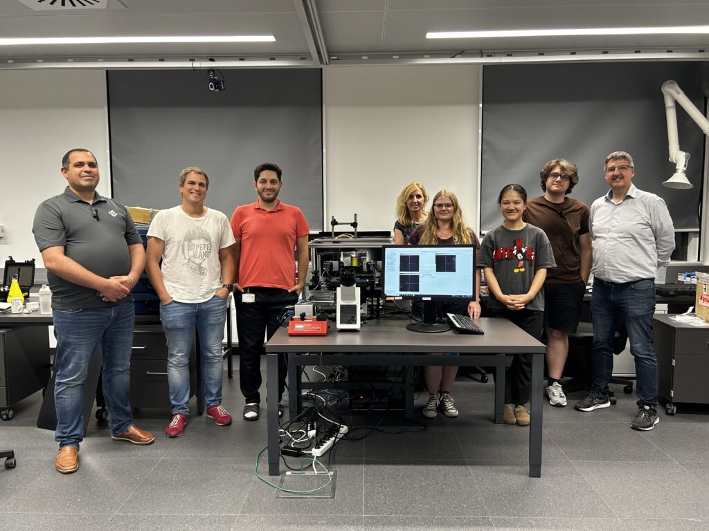 the Biofluidslab Team and Amine Koched gathered around the PIV System