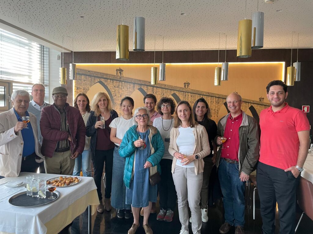 Group Photo of most of the BioMembrOS Team in front of a Photo of a bridge