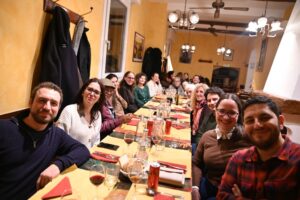 The BioMembrOS team sitting at a table waiting for dinner