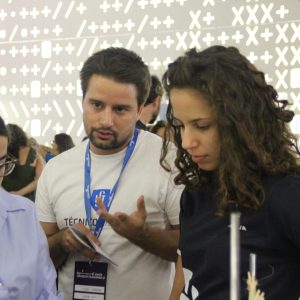 A team member explaining something to visitors